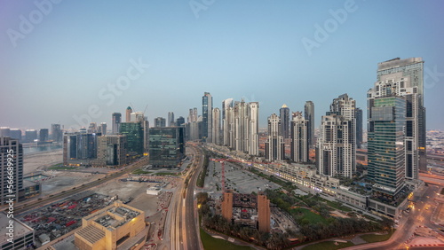 Bay Avenue with modern towers residential development in Business Bay aerial panoramic night to day , Dubai © neiezhmakov