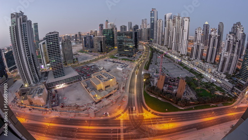 Bay Avenue with modern towers residential development in Business Bay aerial panoramic night to day , Dubai