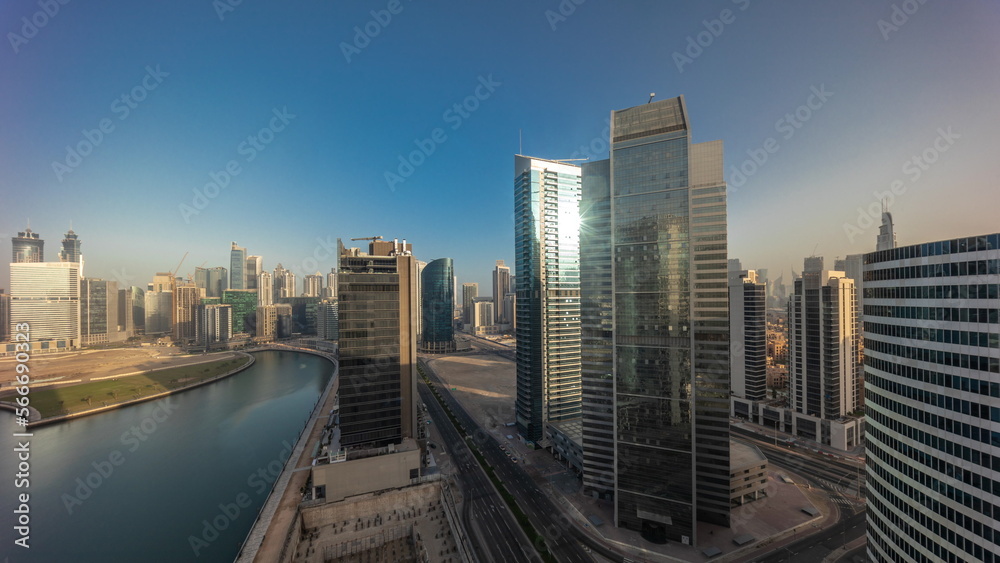 Cityscape skyscrapers of Dubai Business Bay with water canal aerial .