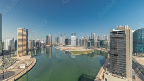 Cityscape skyscrapers of Dubai Business Bay with water canal aerial .