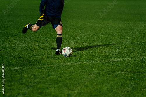 goalkeeper kick ball during football match
