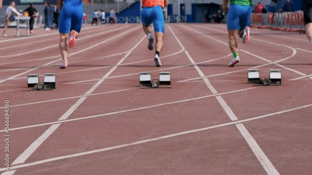 Chelyabinsk, Russia - June 5, 2022: start men athletes run 100 meters in UFD Athletics Championship Chelyabinsk, Russia - June 5, 2022: start men athletes run 100 meters in UFD Athletics Championship
