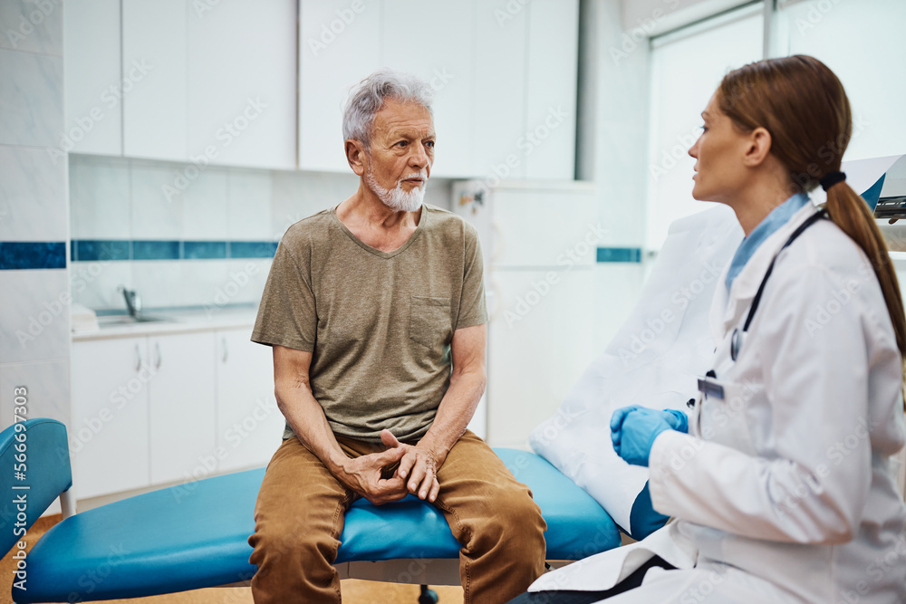 Senior man talks about his medical condition with female cardiologist at doctor's office. Senior man talks about his medical condition with female cardiologist at doctor's office.
