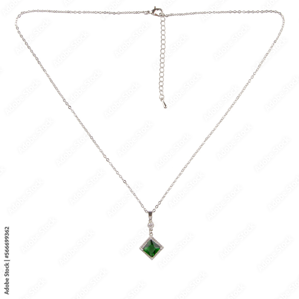 Silver pendant with emerald on a thin chain on a white background Silver pendant with emerald on a thin chain on a white background
