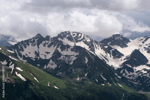 snow on mountain peak in summer in arkhyz © sports photos