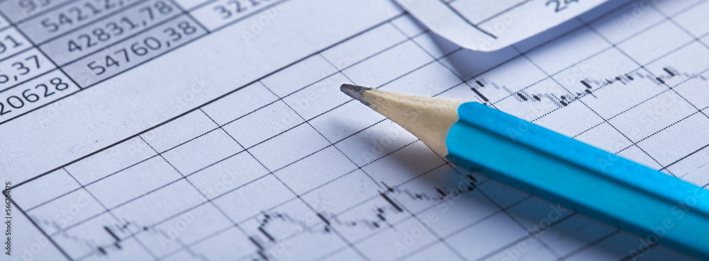 Checking the value of securities. Pencil, share listing and checking financial chart. Concept of banking, financial report and financial audit. Checking the value of securities. Pencil, share listing and checking financial chart. Concept of banking, financial report and financial audit.