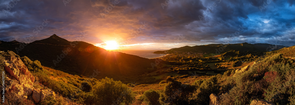 Sea Coast and Landscape near Small Town, Solanas, Sardinia. Dramatic Sunset Sky. Nature Background Panorama