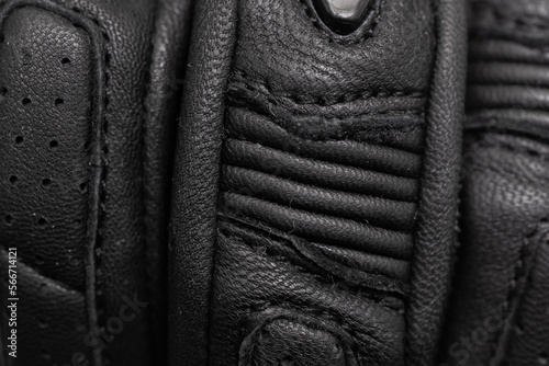 black leather motorcycle gloves. background or texture