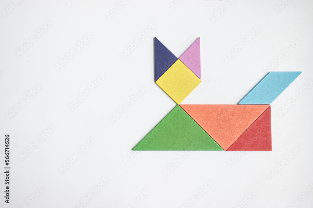 color tangram puzzle in cat shape on wood background color tangram puzzle in cat shape on wood background