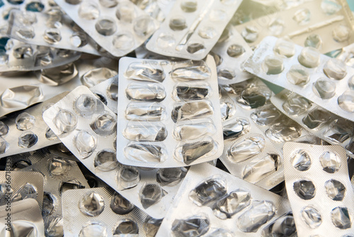 empty used pillboxes blank plates from pills, pharmaceutical background 