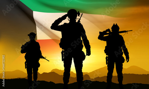 Kuwait flag and the silhouettes of a soldiers on background of sunset. Concept - National, Liberation Days. EPS10 vector