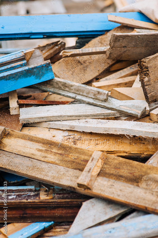 Background, texture of a pile of old, used wooden boards with nails. Close-up photo, construction concept. Background, texture of a pile of old, used wooden boards with nails. Close-up photo, construction concept.