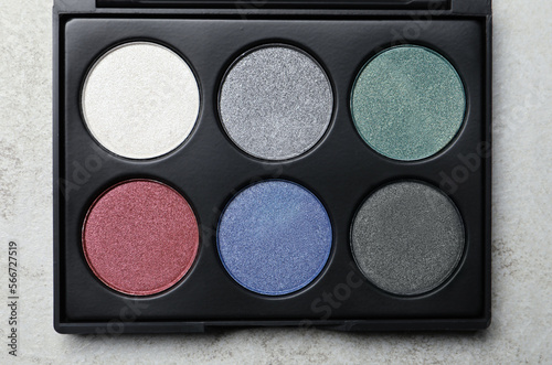 Beautiful eye shadow palette on grey table, top view © New Africa