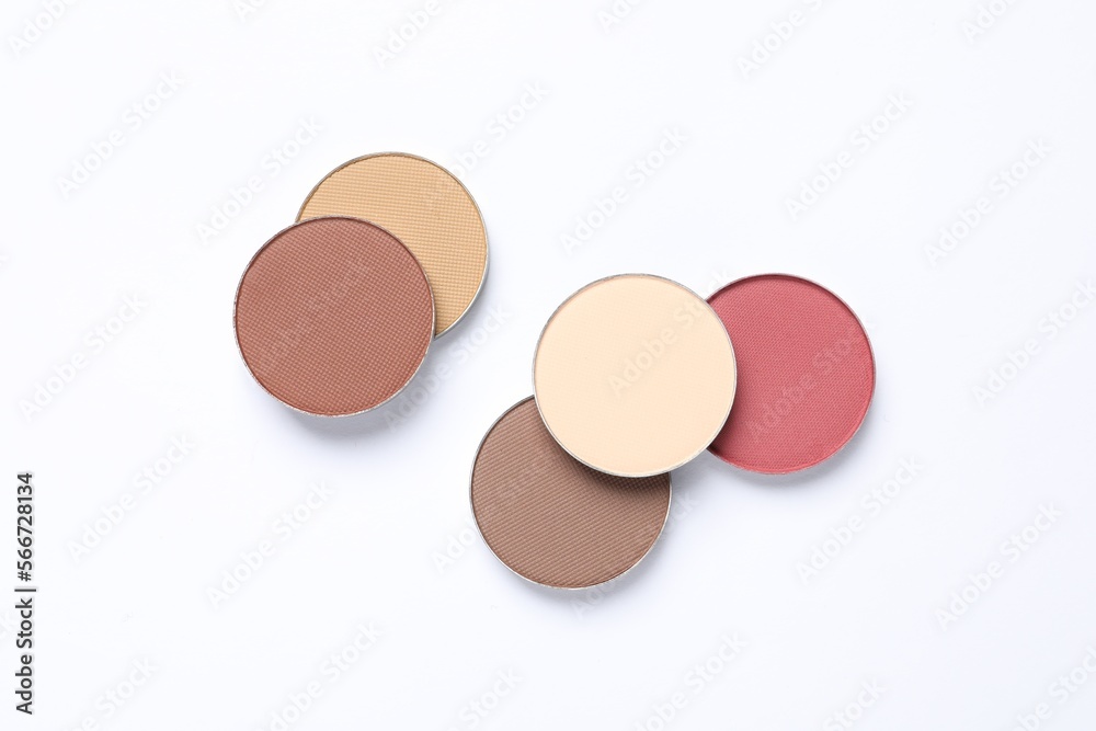 Different beautiful eye shadows on white background, flat lay Different beautiful eye shadows on white background, flat lay