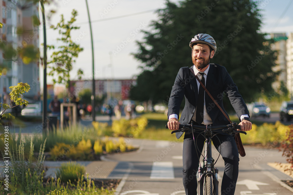 Happy office worker in elegant apparel, riding on cycle path.