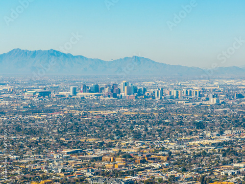 Phoenix downtown modern city skyline aerial view with Estrella Mountain at back, from the top of Camelback Mountain in city of Phoenix, Arizona AZ, USA. 