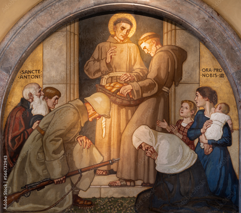 ZURICH, SWITZERLAND - JULY 1, 2022: The fresco St. Anthony of Padua distributing bread in the church St. Anton by Fritz Kunz (1921).