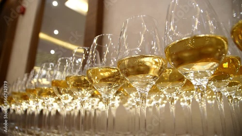 Many glasses of champagne stand beautifully. Glasses of wine at a banquet. photo