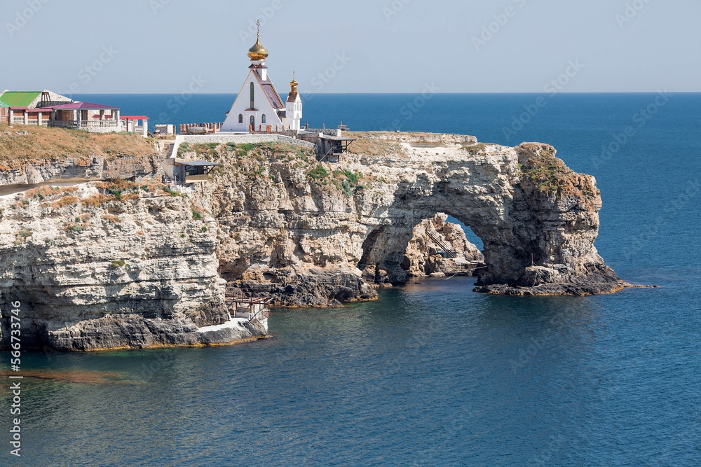 Cape Bolshoy Atlesh of the Tarkhankut Peninsula. The church-chapel of St. Nicholas on the edge of the cape. Russia, Republic of Crimea