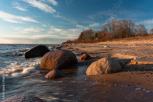 Fototapeta Naklejka Na Ścianę i Meble -  Rocky beach of the Baltic Sea at sunset