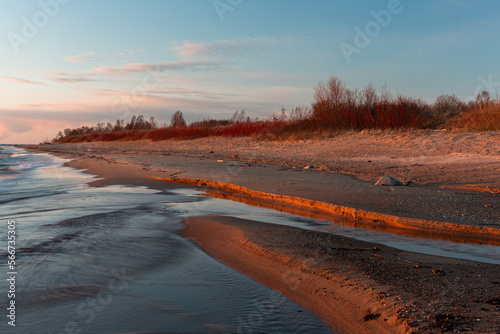 Fototapeta Naklejka Na Ścianę i Meble -  Rocky beach of the Baltic Sea at sunset