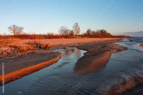 Fototapeta Naklejka Na Ścianę i Meble -  Rocky beach of the Baltic Sea at sunset
