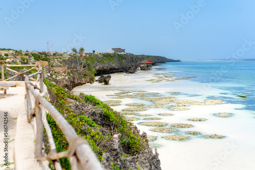 Landscape of the Indian Ocean coastline with at Mtende Beach, Zanzibar. Rocks and white sand. View from the sea