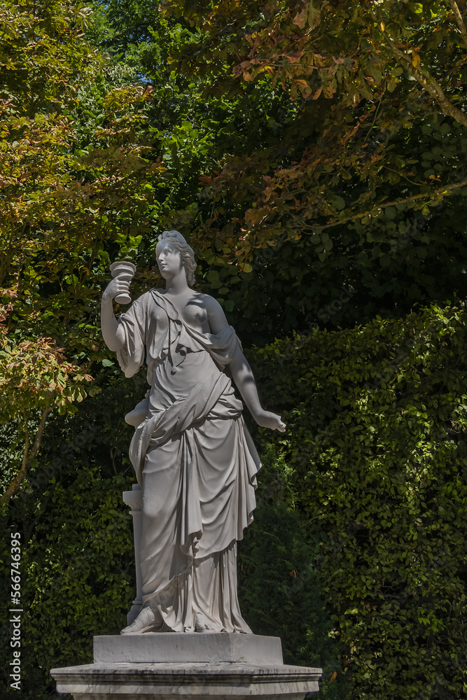 Antique sculpture in Gardens of Versailles palace. Versailles, France.