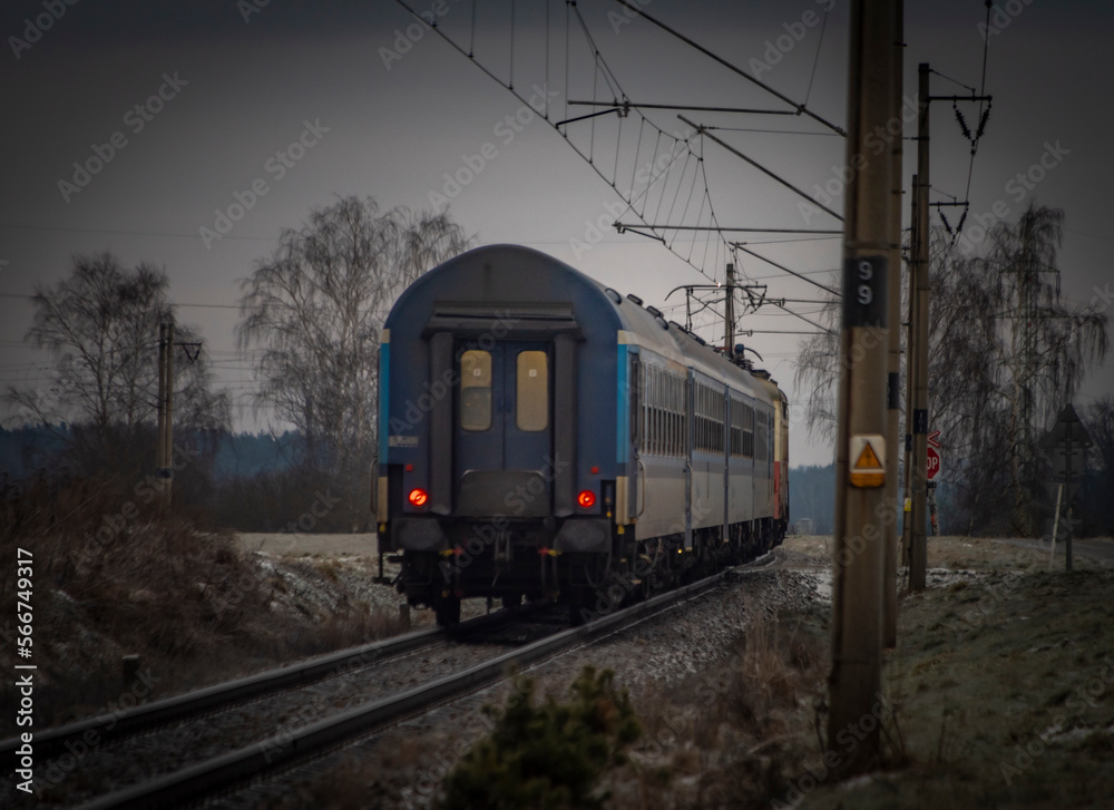 Passenger electric train in frosty cloudy morning near station Donov 01 30 2023