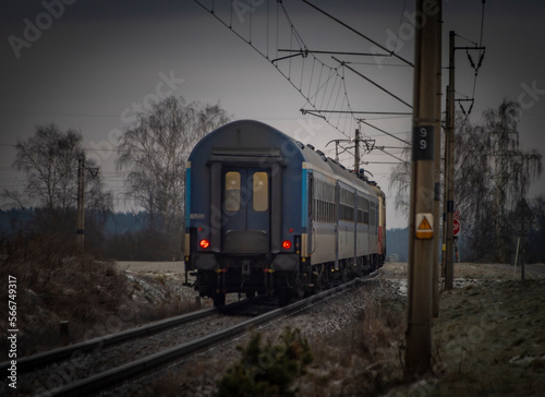 Passenger electric train in frosty cloudy morning near station Donov 01 30 2023