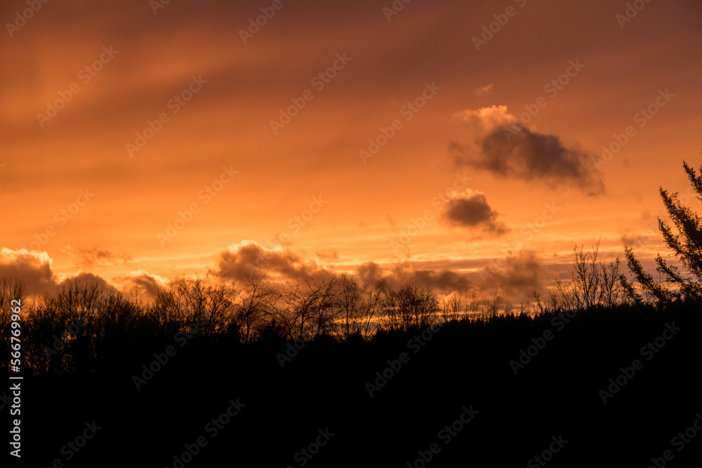 Dramatic clouds on the sky in red colors in the area called Rothaargebirge