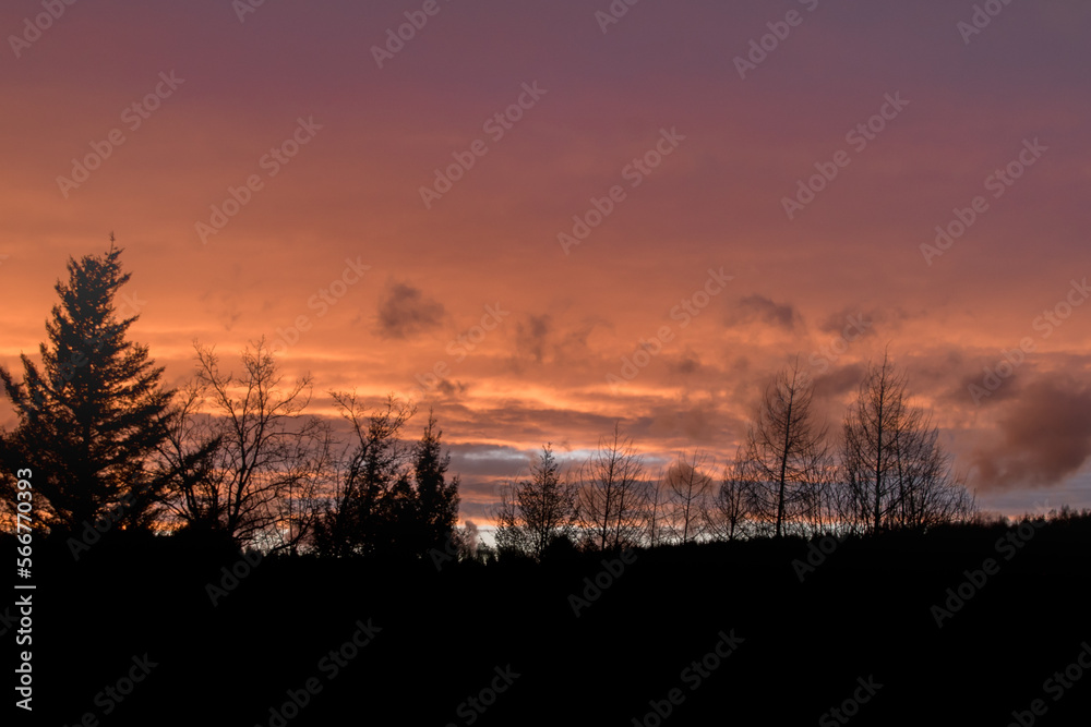 Fototapeta premium Dramatic clouds on the sky in red colors in the area called Rothaargebirge