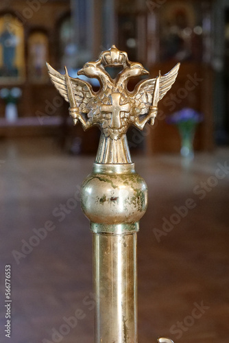 Double-headed eagle with two swords, a cross and a crown in the church