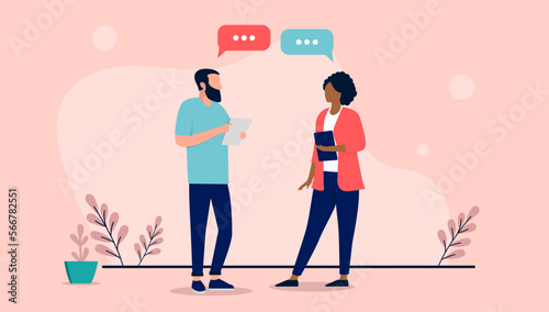 Two people talking - Conversation between businesspeople standing with speech bubbles in air. Flat design vector illustration photo