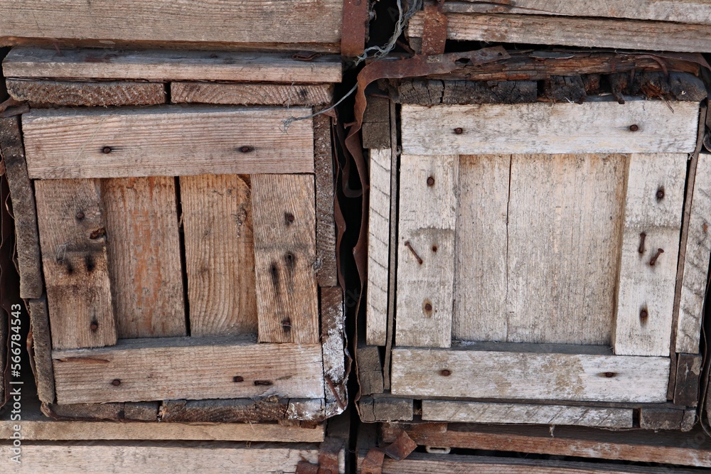 Old wooden boxes are stacked in the warehouse of village store Old wooden boxes are stacked in the warehouse of village store