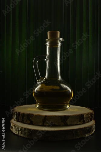bottle of oil on wooden background