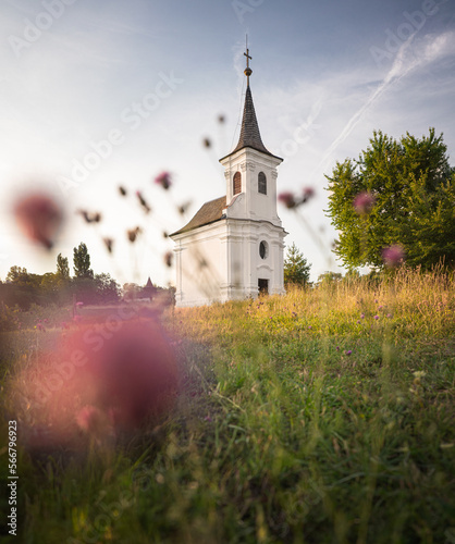 Nice old white chapel with flowers at Balatonlelle