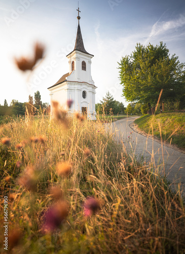 Nice old white chapel with flowers at Balatonlelle photo