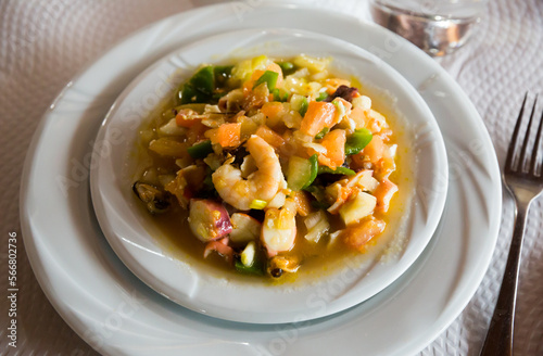 Traditional Spanish seafood salpicon - cold salad from mix of seafood and vegetables..