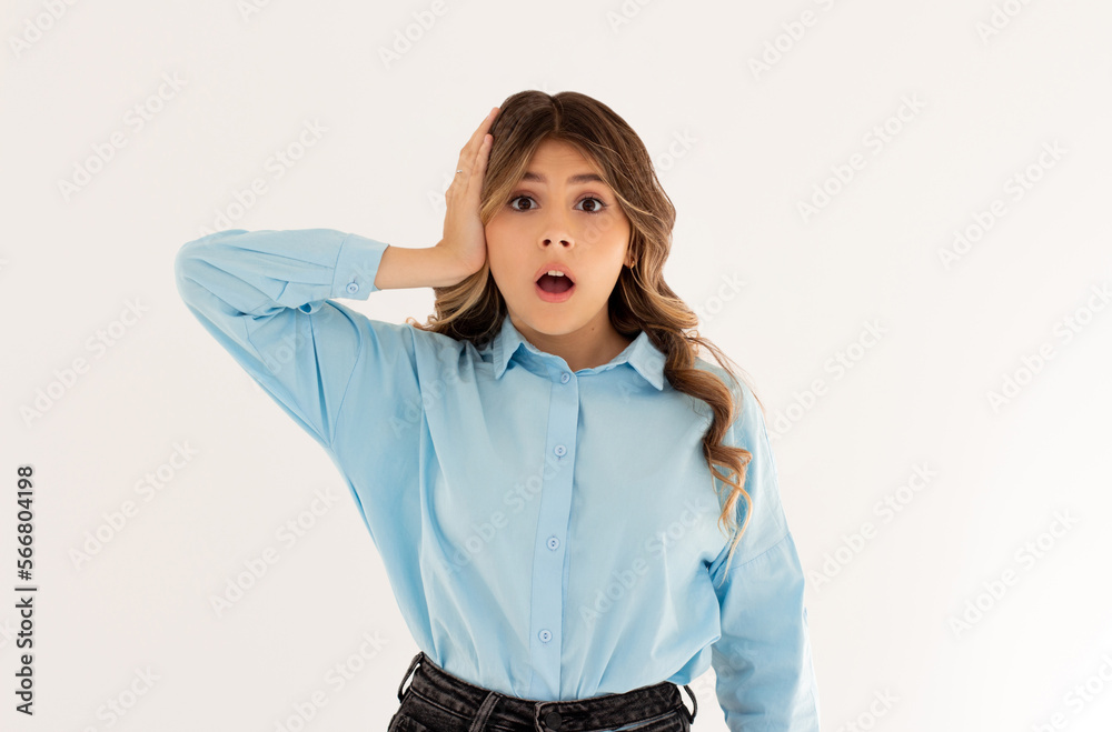 Shocked woman holding hand on head with concerned and anxious face, feeling troubled, facing big problem and looking indecisive at camera, white background. Shocked woman holding hand on head with concerned and anxious face, feeling troubled, facing big problem and looking indecisive at camera, white background.