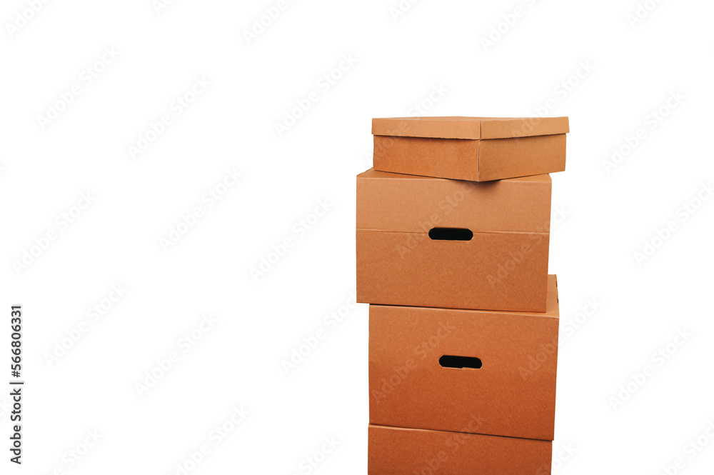 A tower made of some brown carton boxes over white background in a studio.