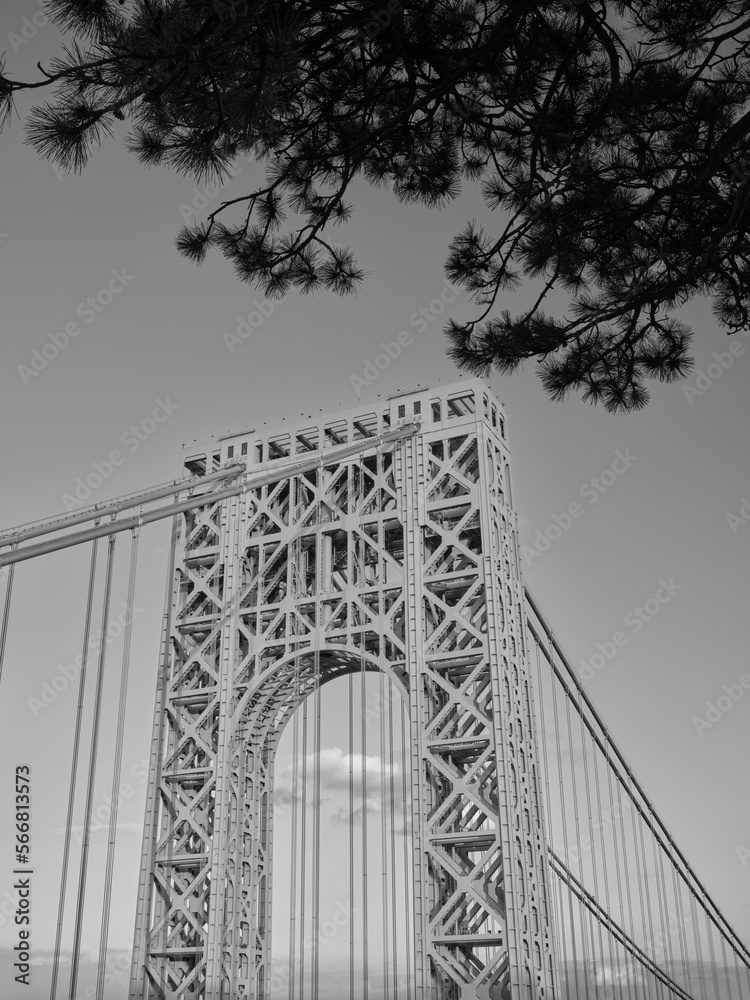 Fototapeta premium Black and white vertical image of one of the suspension towers supporting the George Washington Bridge spanning the Hudson River from Fort Lee NJ to upper Manhattan