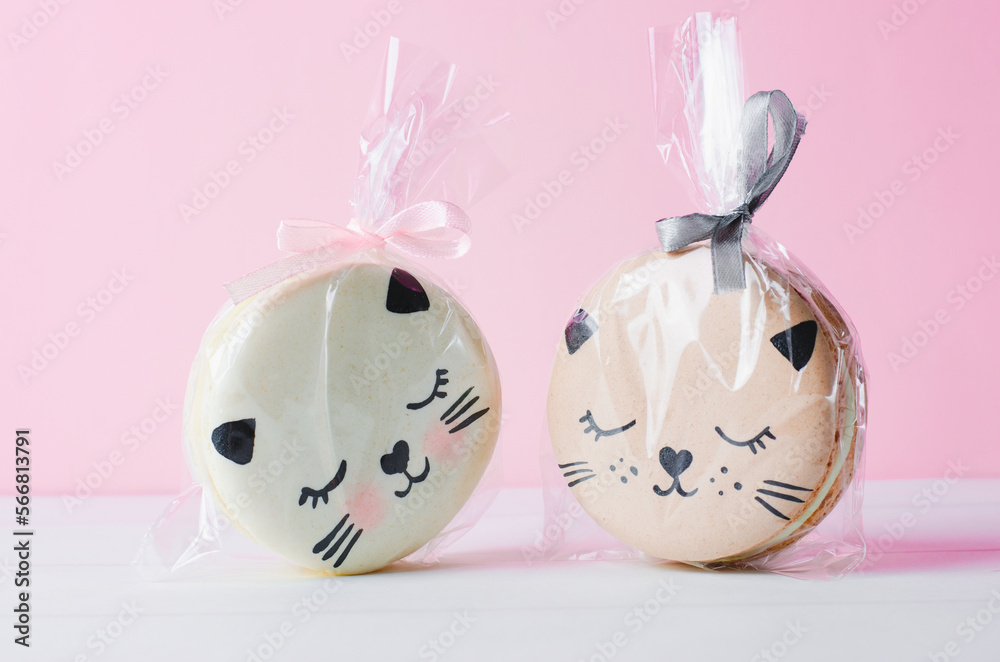 Adorable Cat Macaron Cookies, French Dessert on Bright Background Adorable Cat Macaron Cookies, French Dessert on Bright Background