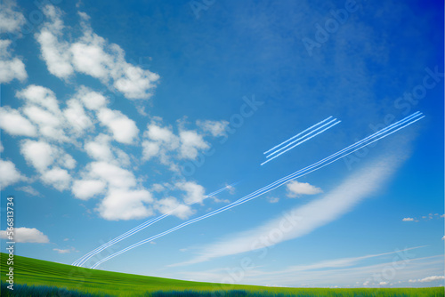 Contrail in the blue sky and meadow