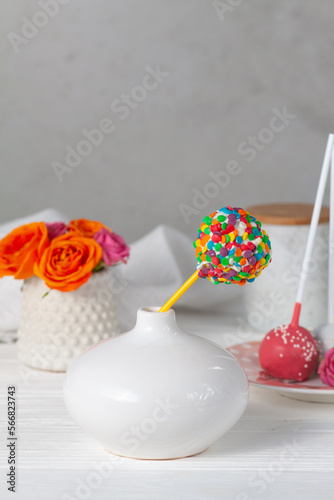 Bright cake pops dessert on the table. Festive good mood