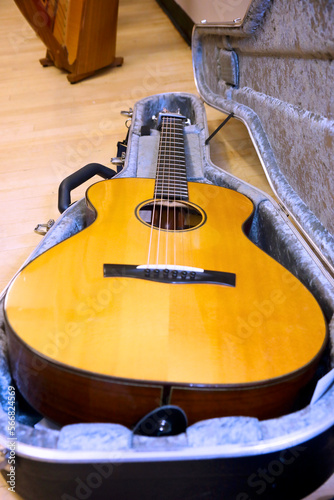 wooden guitar in a case