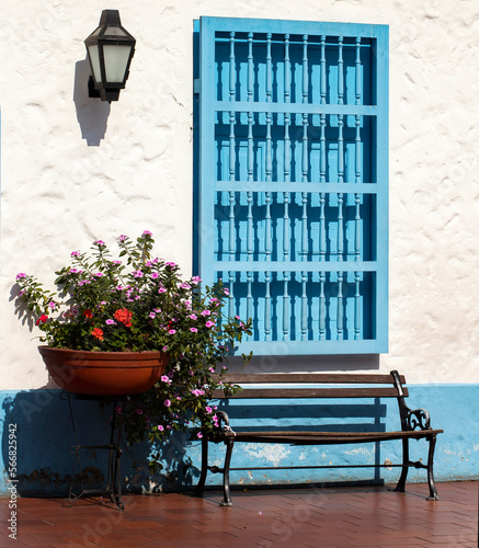 traditional Colombian architecture, white facade with blue window