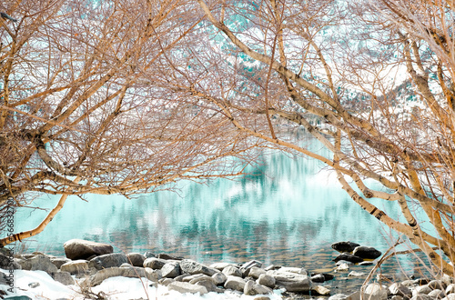 The emerald lake with the stones. Tranquil nature landscaped. Beautiful lake and view. photo