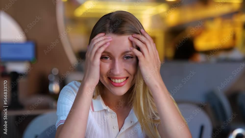 Beautiful joyful female sitting in restaurant and talking to camera. Close up of happy pretty young woman on a date speaking and looking at camera in good mood and smiling. Real time. Beautiful joyful female sitting in restaurant and talking to camera. Close up of happy pretty young woman on a date speaking and looking at camera in good mood and smiling. Real time.