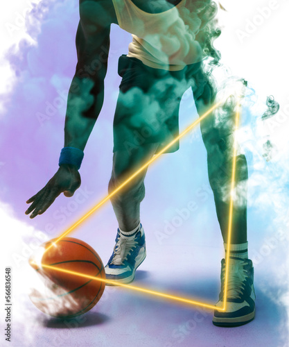 Low section of african american basketball player dribbling ball by triangle on smoky background